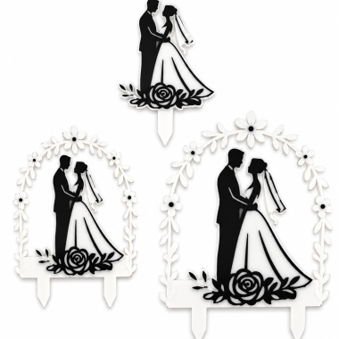 Wedding cake topper collection with bride and groom silhouette and floral details.