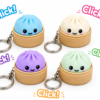 Forjolie dim sum bao-shaped clicker keychains in blue, purple, white, and green with Click sound effect graphics