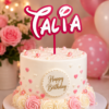 Forjolie personalized cake topper reading Talia on a pink birthday cake with roses and balloons