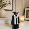 Forjolie graduation tassel decor displayed on a console table with a vase and candles