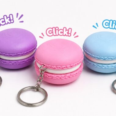 Macaron clicker keychains in purple, pink, and blue, a cute and clickable keychain gift.