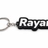 Forjolie black and white Rayan name keychain on a keyring