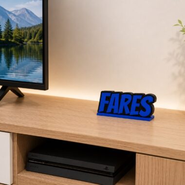 Personalized 3D name sign with "Fares" in blue, displayed on a shelf with electronics, custom