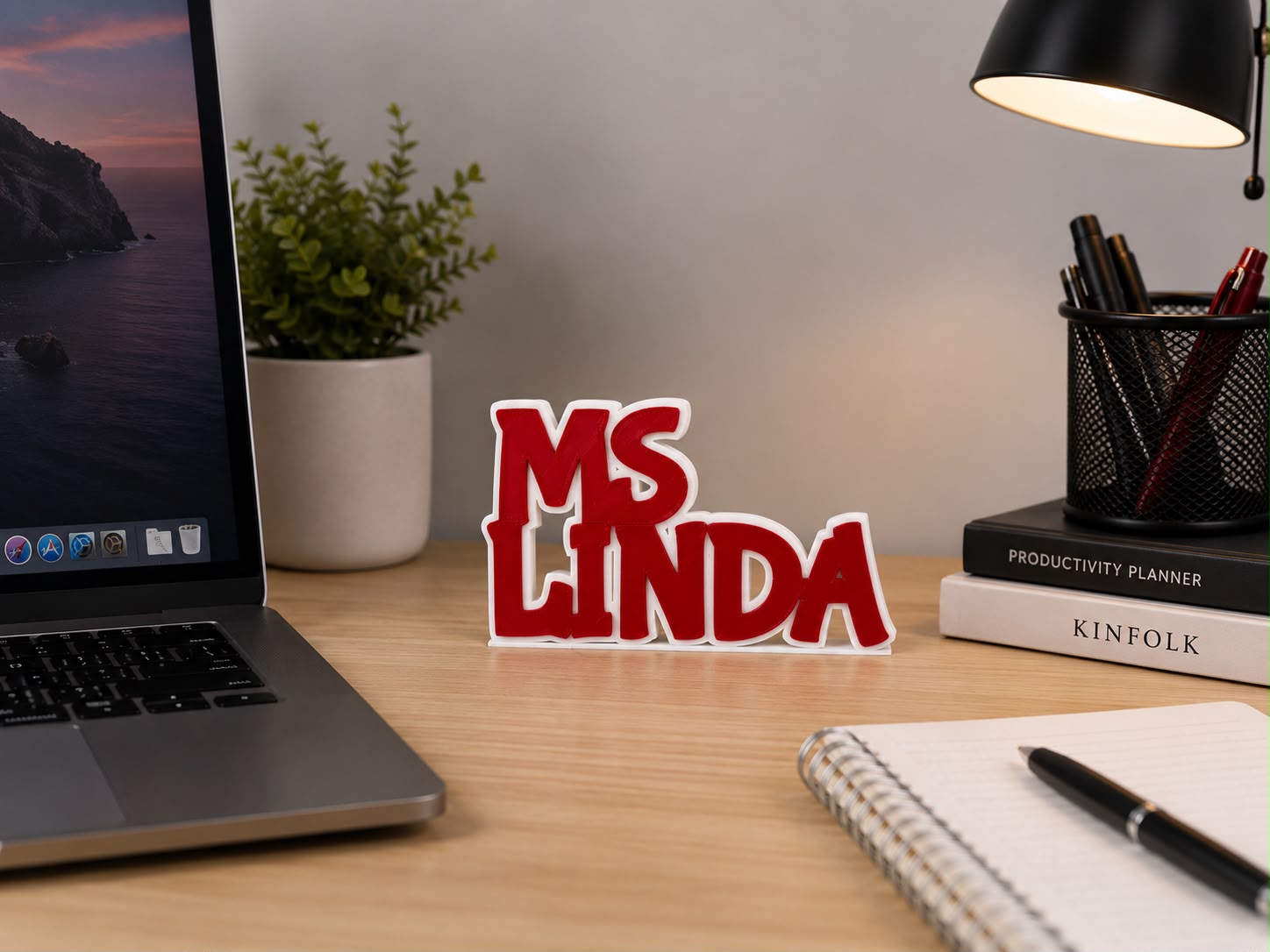 Personalized stacked name board with "Ms. Linda" lettering, Dubai-made 3D design on a desk with