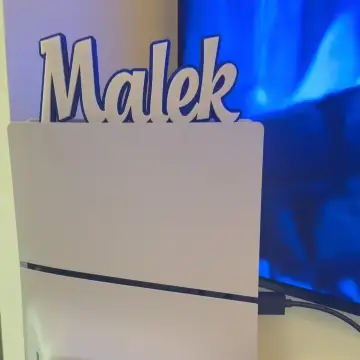 Personalized name board with "Malek" lettering, 3D printed in Dubai for home decor.