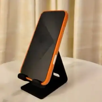 Personalized gaming accessories, PS5 Dual Controller Stand in orange, designed and printed in Dubai.