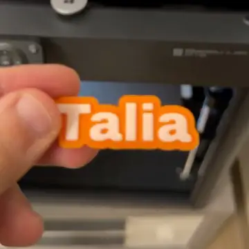Personalized keychain with "Talia" name, Forjolie.dxb custom creation.