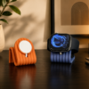 Forjolie 3D-printed earbud case stands in orange and blue on a desk