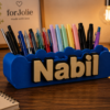 Forjolie personalized 3D-printed desk organizer with the name Nabil, holding colorful pens on a desk