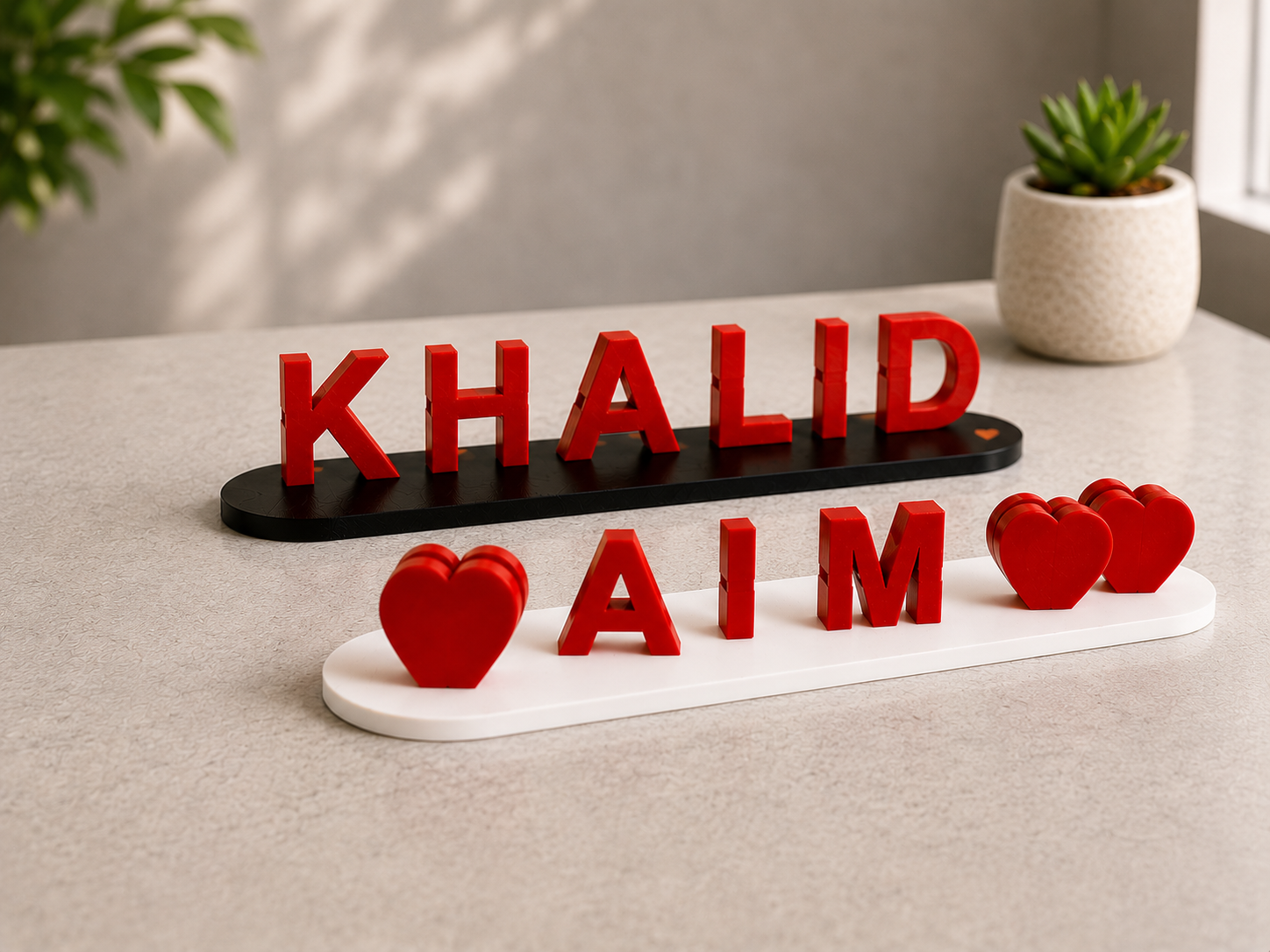 Personalized name sign with "Khalid" and "Aaim" in 3D print, decorative hearts and PLA material.