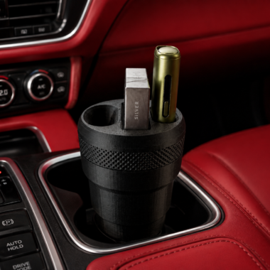 3D printed IQOS car holder installed in a car's cup holder, holding two IQOS devices - Forjolie.dxb
