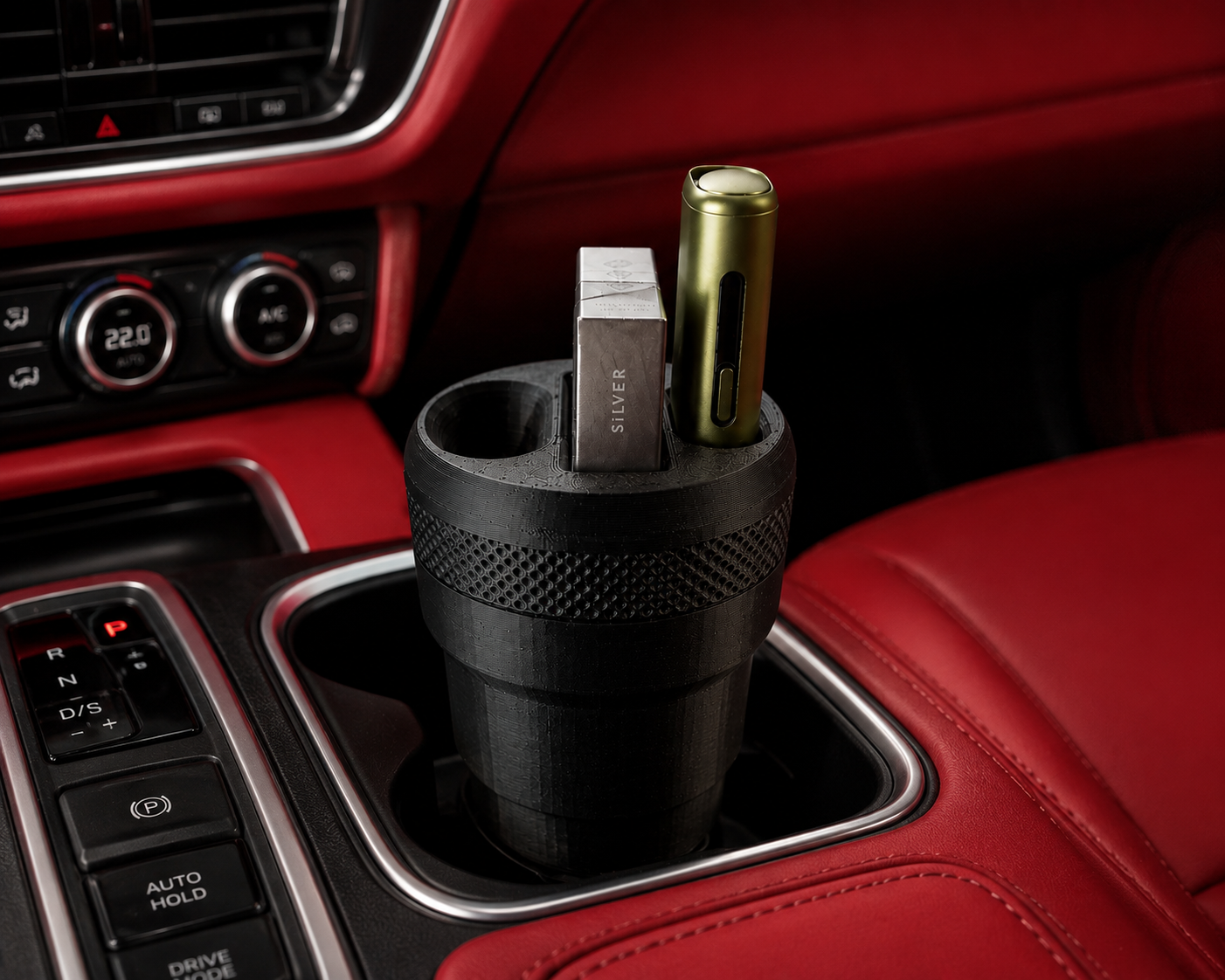3D printed IQOS car holder in a vehicle's cup holder, showcasing compartments for an IQOS